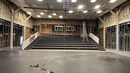 During renovations of Highland Hall, the stage has been removed, but the risers for seating and dropped ceiling remain.