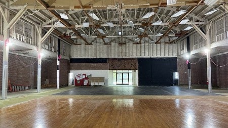 During renovations of Highland Hall, the original gymnasium floors were uncovered and the ceiling opened to the rafters above. 