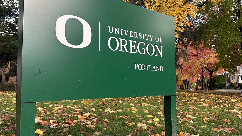 UO Portland landmark sign with fall leaves