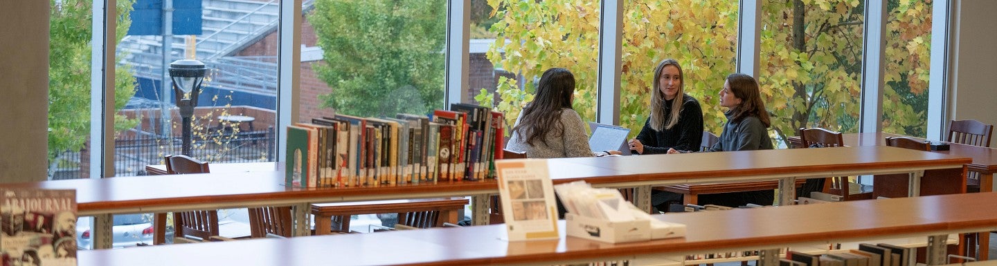 Students sit in the UO Portland Library