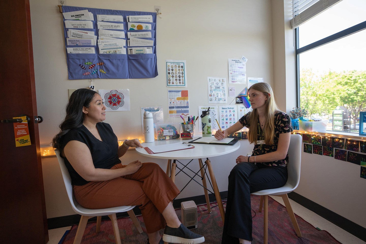 Anne Libby, right, works at a clinic as a student with the Ballmer Institute for Children's Behavioral Health