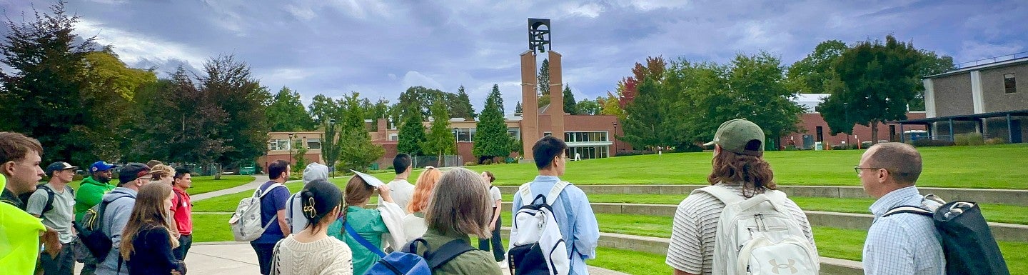 Students outside on at the UO Portland campus green