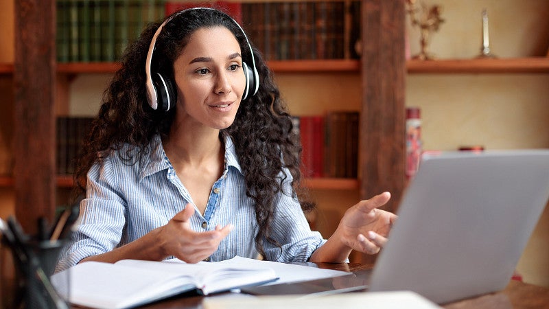 stock image of woman taking online course