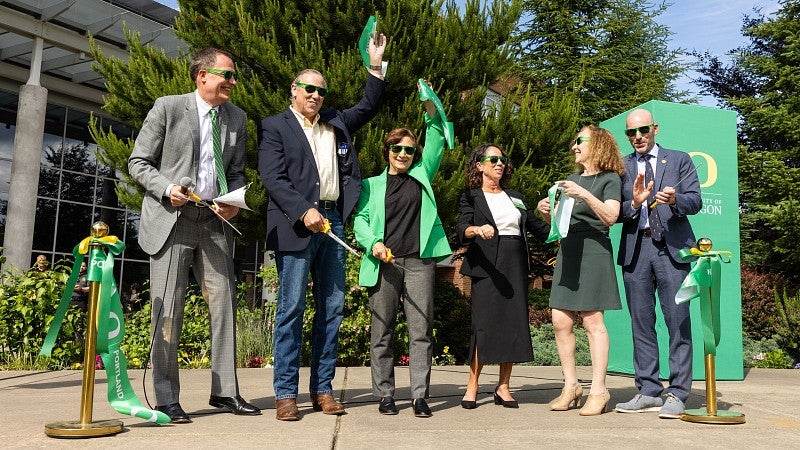 People celebrating a ribbon-cutting
