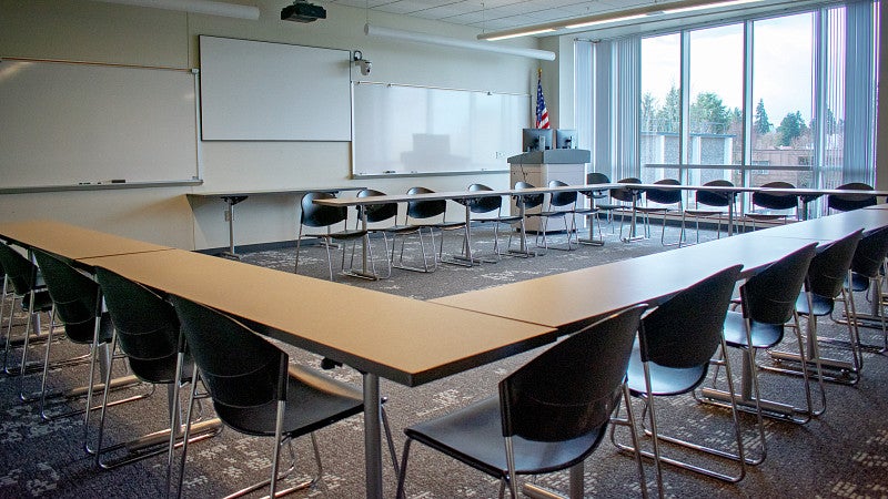 Classroom 301 has tables set in a U shape. 
