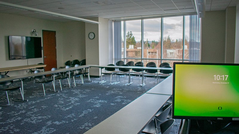The room has two large windows overlooking the fields and neighborhood. 