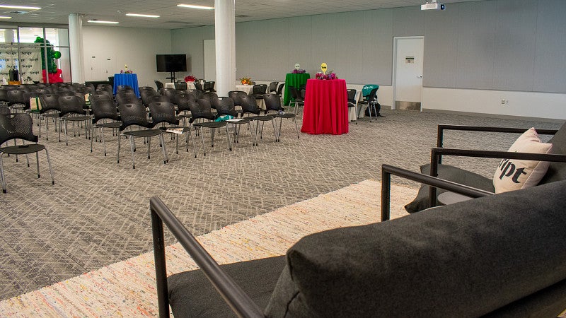 A small stage is available to use in the room. 