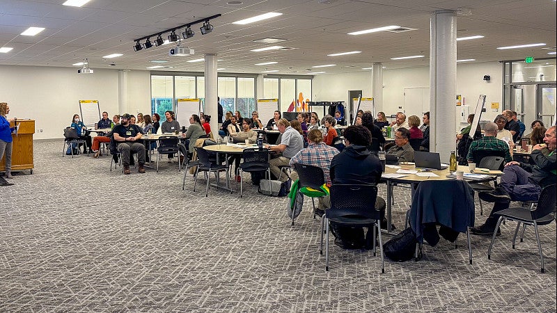 The space overlooks the floor below and the campus green. 