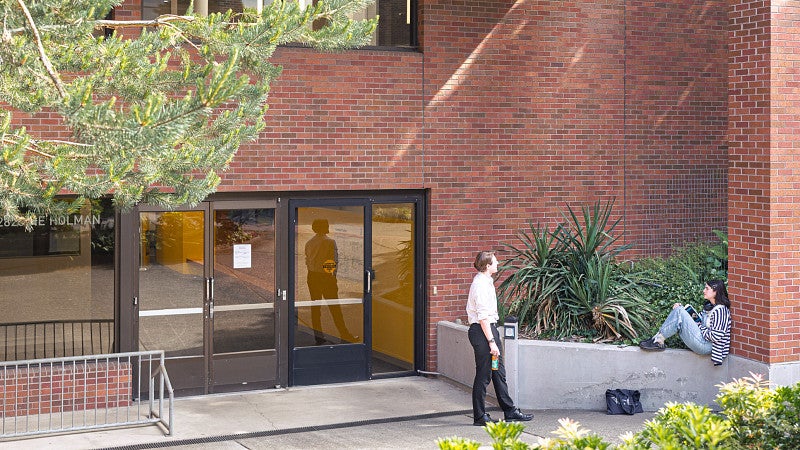 Students talking in front of the Campus Center building 