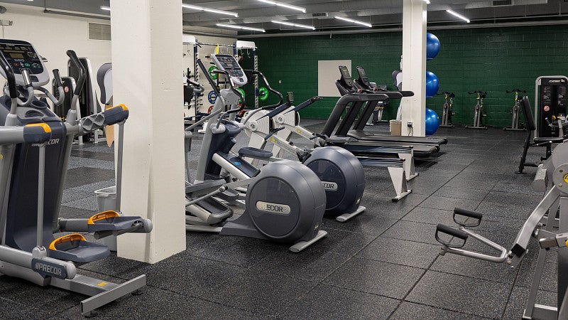 The fitness center has cardio machines, free weights and other equipment. 