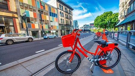 A public bike on a sidewalk in Portland, OR