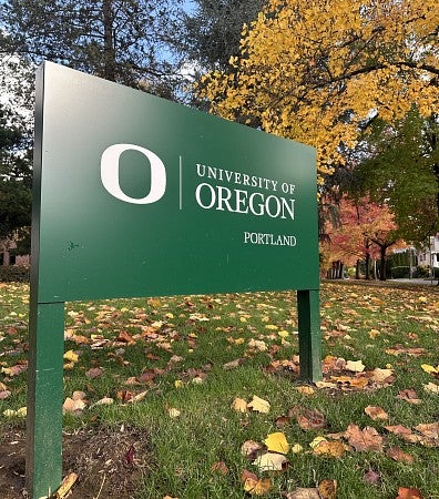 UO Portland landmark sign with fall leaves