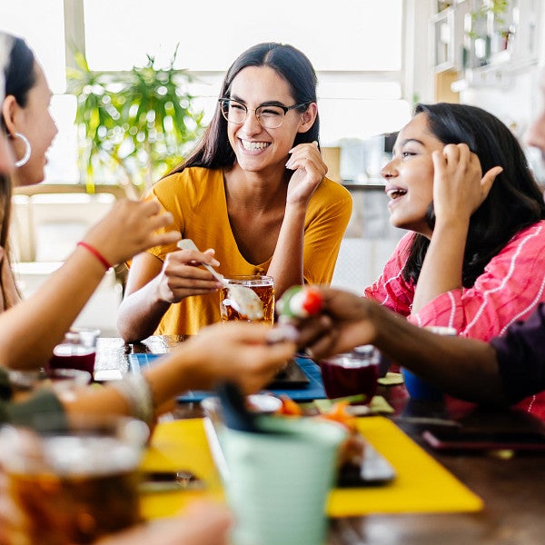 Young adults eating stock image