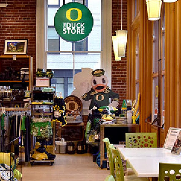 The Duck Store has apparel and souveniers and a seating area by a window.