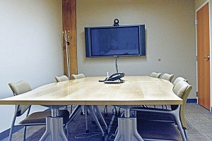 Conference Room 366D is a small room with one big table, chairs and a screen.