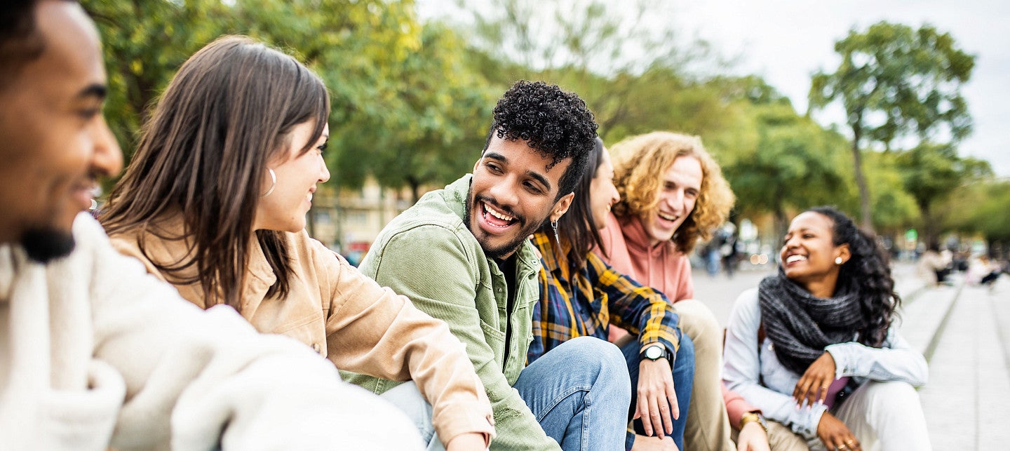 students sitting outside