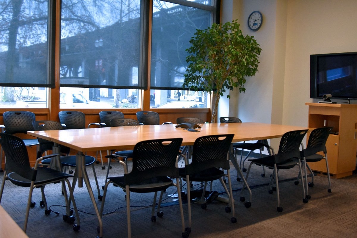 Conference room setup option features one large table with chairs on all sides.