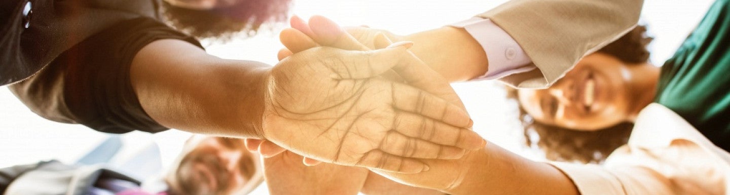Hands coming together Hands coming together