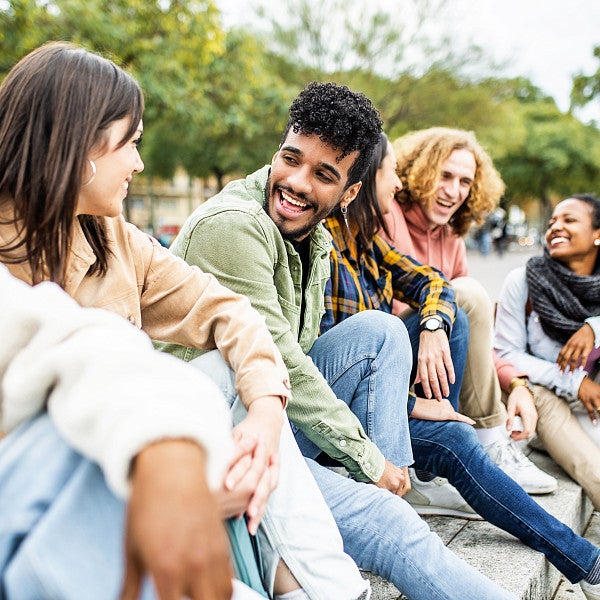 Stock image of people sitting outside